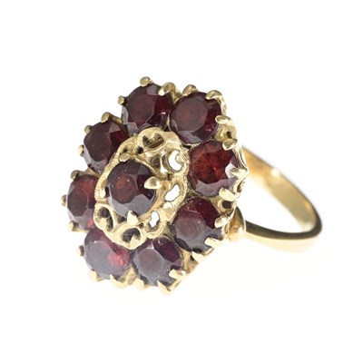 Lot 2 - A 15ct garnet cluster ring, partially stamped,...