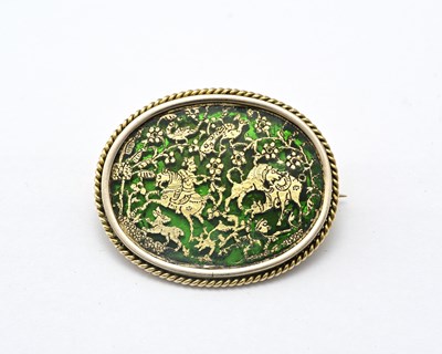 Lot 14 - A 9ct gold brooch depicting a huntsman and...