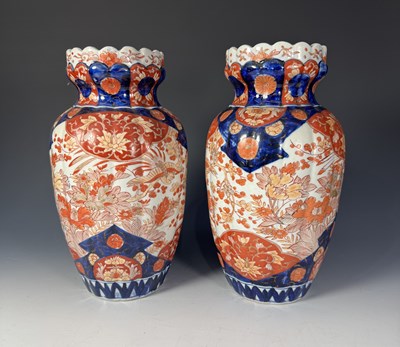 Lot 299 - A pair of ribbed form Imari vases with scallop...