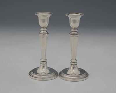 Lot 74 - A pair of Elizabeth II silver candlesticks, by...
