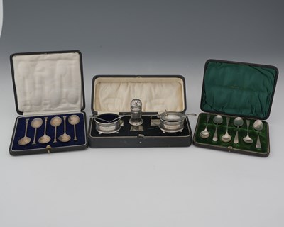 Lot 154 - A George V silver cased condiment set, by...