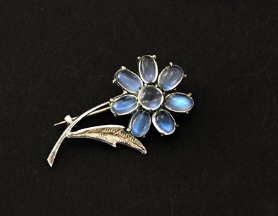 Lot 49 - An Art Deco silver and moonstone flower brooch,...