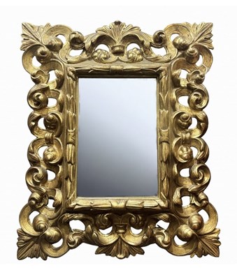 Lot 490 - An Italian Florentine gilt wood wall mirror,...