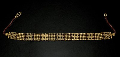 Lot 37 - An Indian gold coloured metal and garnet...