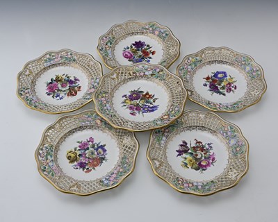 Lot 640 - A set of six floral painted reticulated...