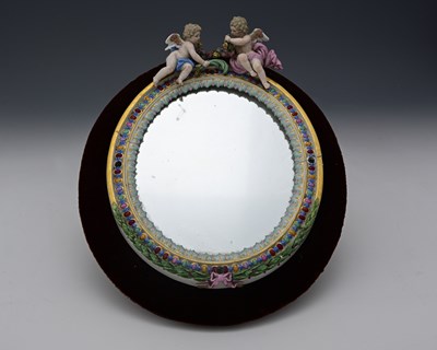 Lot 632 - A Meissen putti and florally encrusted mirror,...