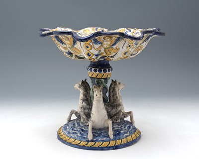 Lot 624 - A Continental painted faience figural tazza,...