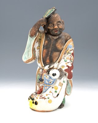 Lot 440 - A Japanese Kutani porcelain figure group,...