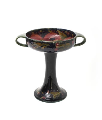Lot 36 - 'Pomegranate' a Moorcroft Pottery twin-handled...