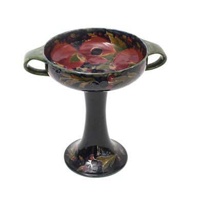 Lot 36 - 'Pomegranate' a Moorcroft Pottery twin-handled...