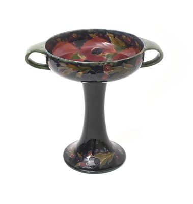 Lot 36 - 'Pomegranate' a Moorcroft Pottery twin-handled...