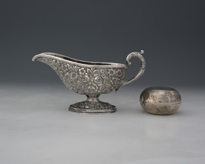 Lot 13 - A white metal sauce boat, twentieth-century,...