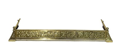 Lot 156 - An Arts & Crafts brass fender, circa 1900,...