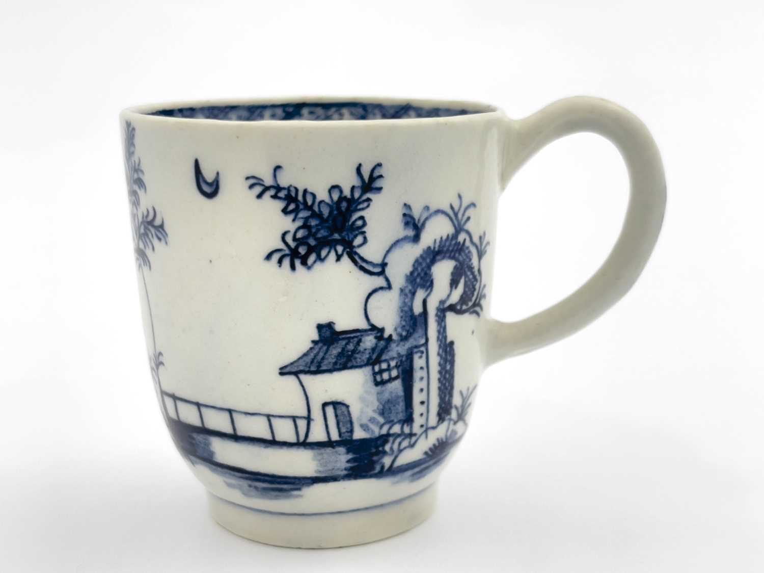 Lot 1002 - A Lowestoft Long Fence pattern coffee cup,...
