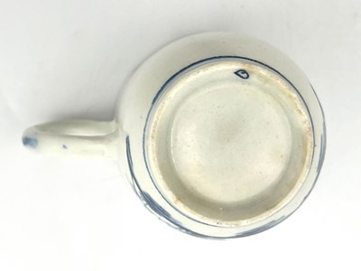Lot 1002 - A Lowestoft Long Fence pattern coffee cup,...