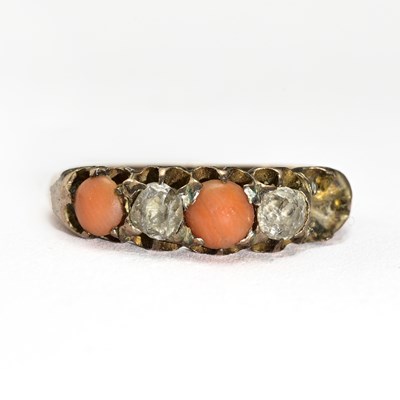 Lot 17 - An early 20th century diamond and coral ring, AF