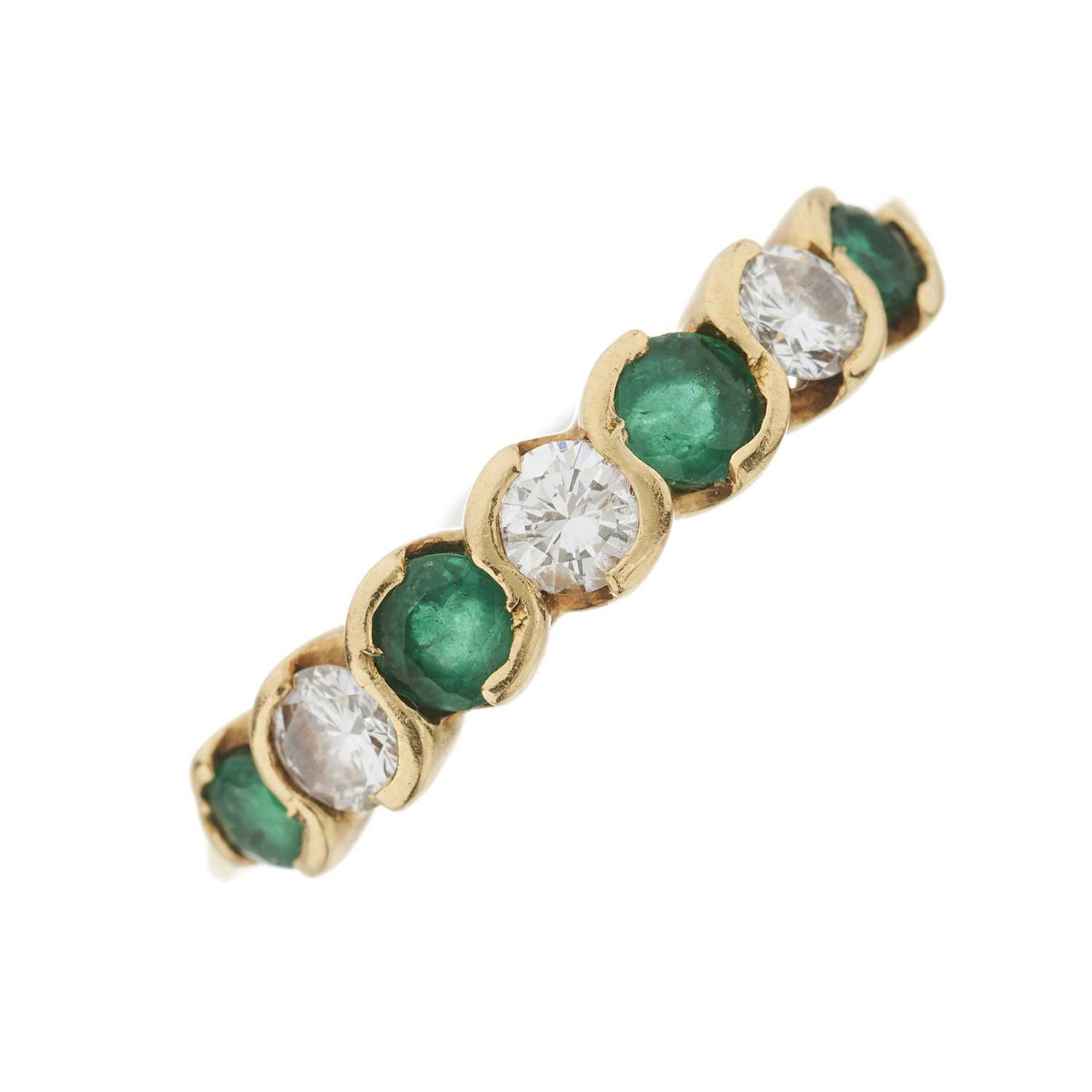 Lot 28 - An 18ct gold emerald and diamond seven-stone ring