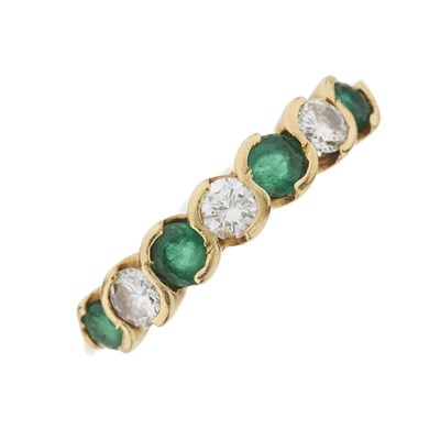Lot 28 - An 18ct gold emerald and diamond seven-stone ring