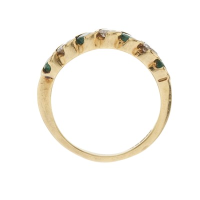 Lot 28 - An 18ct gold emerald and diamond seven-stone ring
