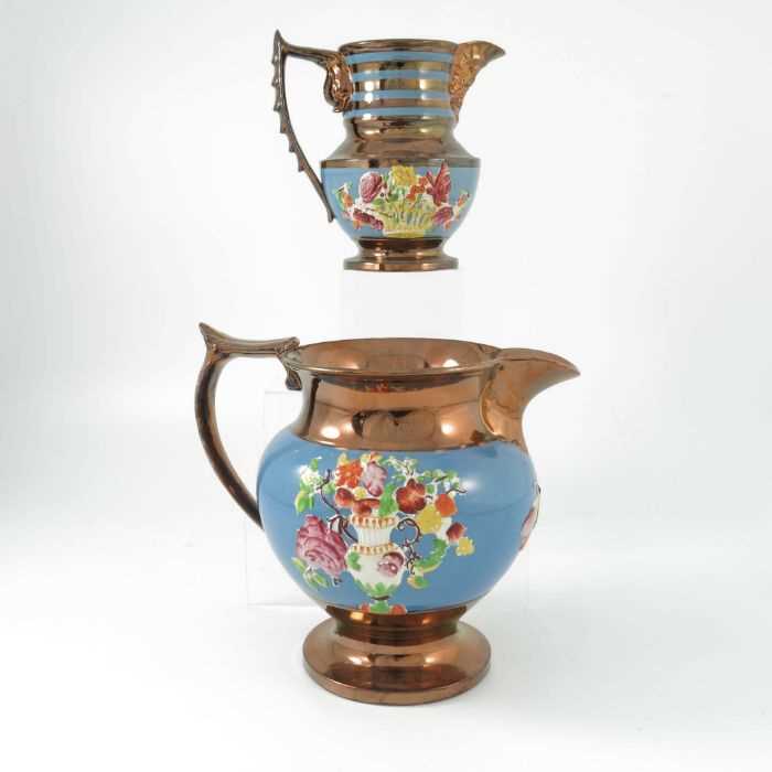 Lot 1009 - Two 19th century Copper lustre jugs, baluster...