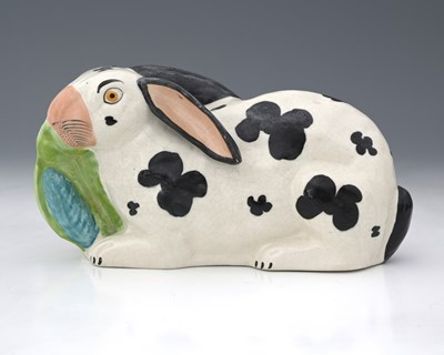 Lot 830 - A Staffordshire pottery figure of a rabbit,...