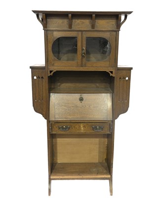 Lot 509 - An Arts & Crafts oak standing bureau bookcase,...