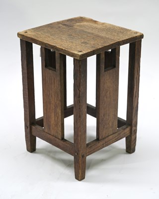 Lot 506 - A small Arts & Crafts oak occasional table in...