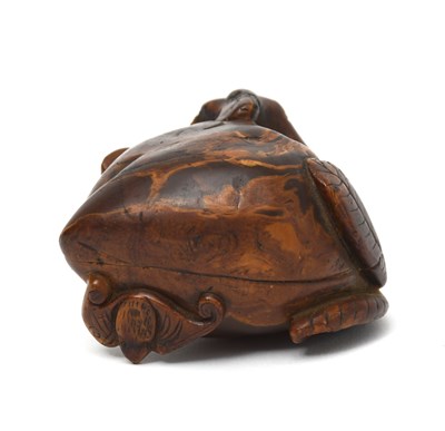 Lot 482 - A Chinese amber encased wooden peach and bat...