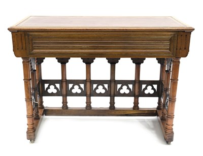 Lot 501 - A walnut Gothic Revival writing table in the...