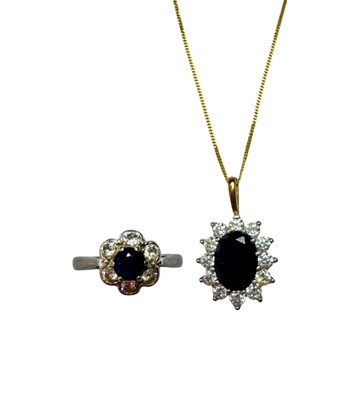 Lot 658 - An 18ct gold sapphire and diamond cluster ring, and a 9ct gold sapphire and cubic zirconia pendant