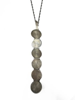 Lot 648 - A silver ball pendant, on chain