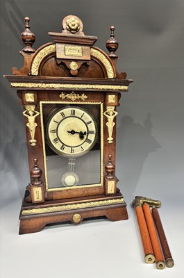 Lot 374 - An American walnut bracket clock, late 19th...