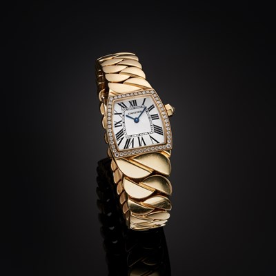Lot 193 - Cartier, an 18ct gold La Doña De Cartier bracelet watch