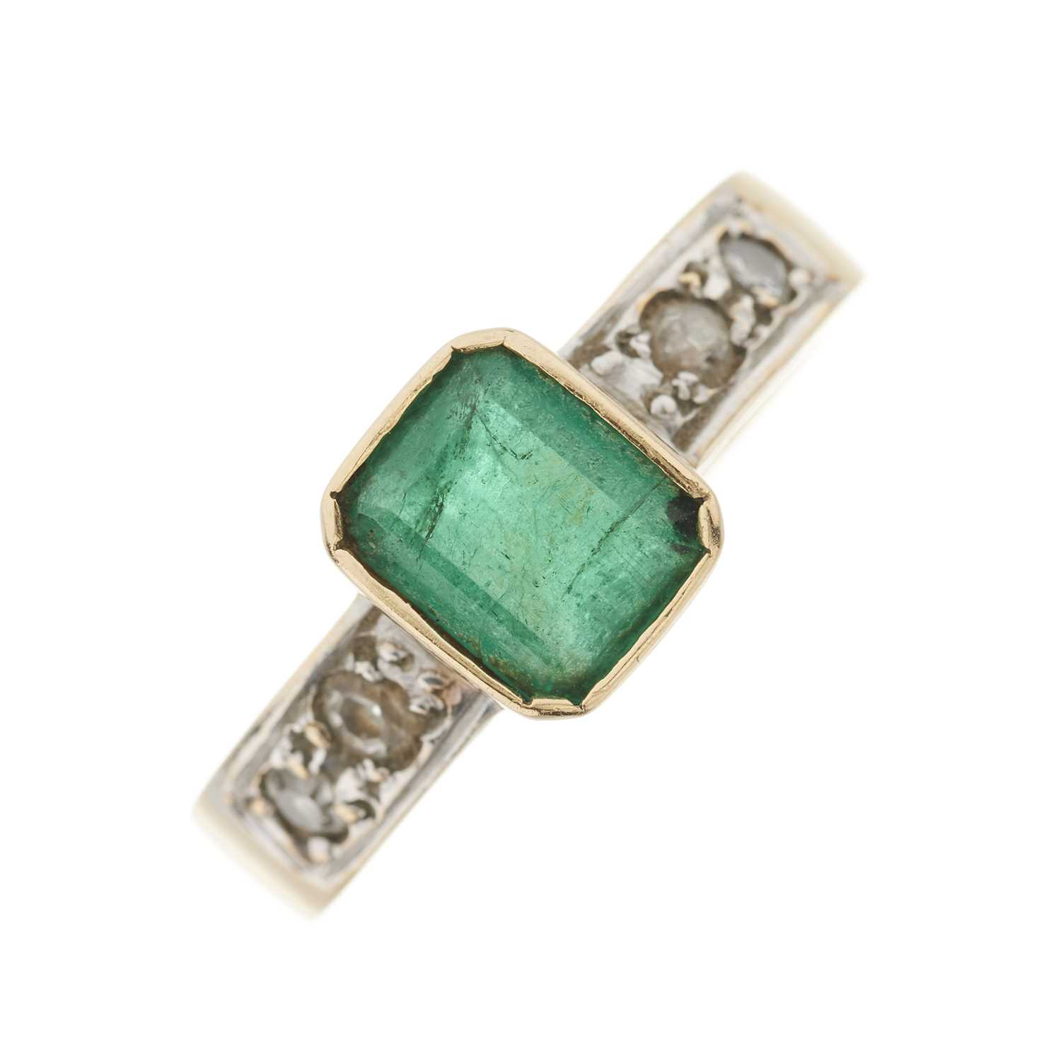 Lot 89 - A gold emerald and diamond dress ring