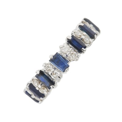 Lot 175 - An 18ct gold sapphire and diamond full eternity ring