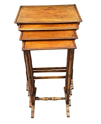 Lot 912 - A nest of four mahogany Regency tables with...
