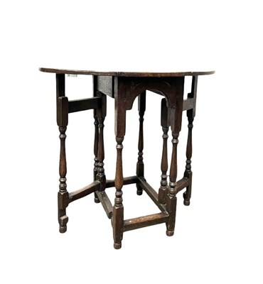 Lot 894 - A small oak gate leg table, 18th century or...