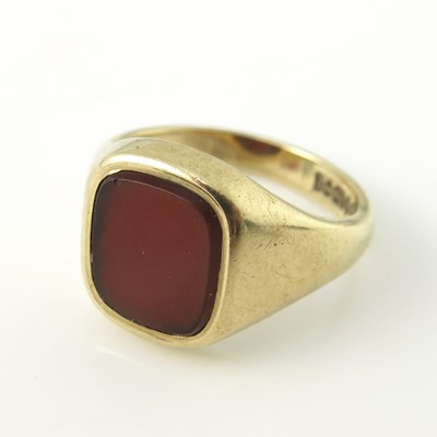 Lot 159 - A 9 carat gold and carnelian set signet ring,...