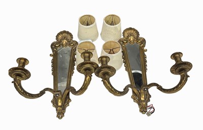 Lot 411 - A pair of 18th century style two arm brass...