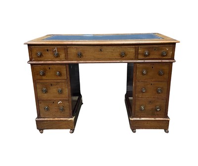 Lot 890 - A small mahogany twin pedestal desk, blue...