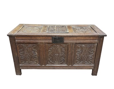 Lot 933 - An 18th century or earlier panelled oak coffer...