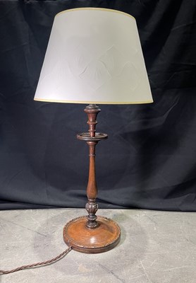 Lot 85 - A turned and carved oak table lamp, round base...