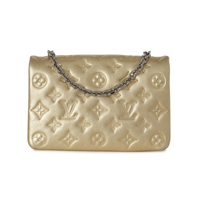 Lot 455 - Louis Vuitton, a gold Pochette Coussins pouch.