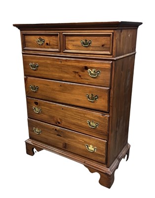 Lot 940 - A tall wooden chest, two short over four long...