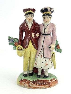 Lot 1023 - A Staffordshire figure, married couple, circa...