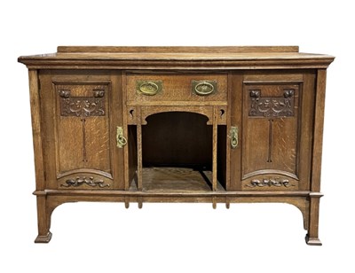 Lot 954 - An oak arts and crafts sideboard, central...