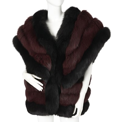 Lot 541 - An oversized plum and black fox fur gilet.