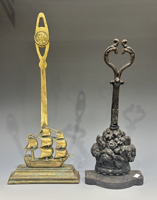 Lot 422 - Two Victorian cast metal door porters, one of...