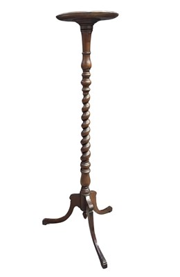 Lot 957 - A mahogany tripod torchere or pot stand,...