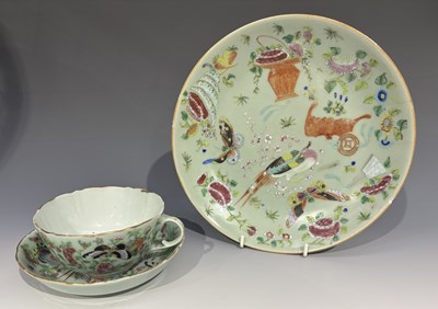Lot 317 - A famille rose celadon ground plate enamelled...